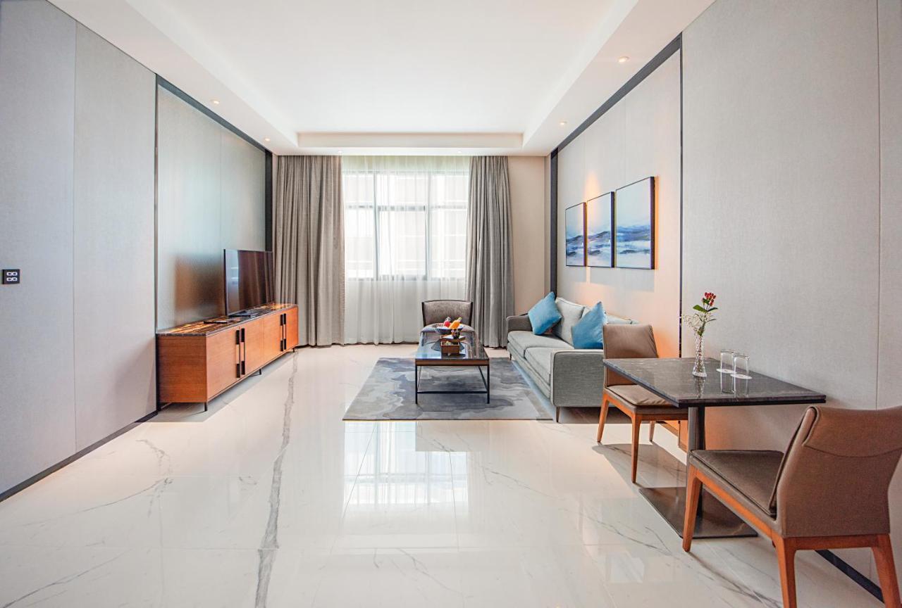 דובאי Asiana Grand Hotel מראה חיצוני תמונה A living room in a serviced apartment in Beijing, China